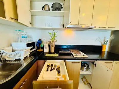 a kitchen with a sink and a counter at Venice IG-Worthy , Netlfix Getaway walking distance to Mall in Manila