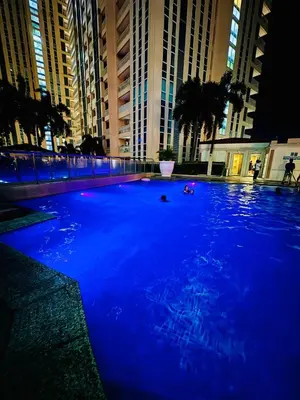 a large pool of blue water in front of buildings at Venice IG-Worthy , Netlfix Getaway walking distance to Mall in Manila