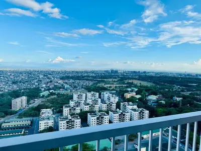 a view of a city from the balcony of a building at Venice IG-Worthy , Netlfix Getaway walking distance to Mall in Manila