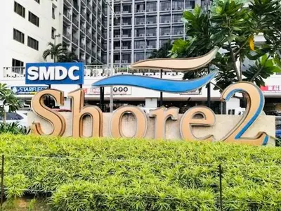 a large sign that says samsung in front of a building at S Suite Home MOA Staycation in Manila
