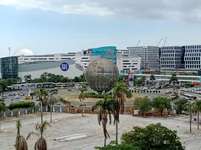 a view of a city with a disco ball and palm trees at Sea Residence Tower EF Lets in Manila