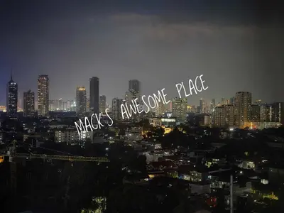 a city skyline at night with the words makeavis entrance place at CUBAO Macks Awesome Place NETFLIX UNLIFAST WIFI in Manila