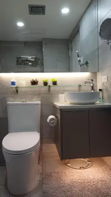 a bathroom with a white toilet and a sink at 2 BR, 2 Full Bathrooms, with hotel feels and a jet tub in Manila