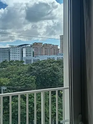 a view of a city from a window at Condo Suite 1 Bedroom McKinley West Taguig City in Manila