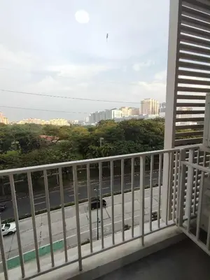 a balcony with a view of a street at Condo Suite 1 Bedroom McKinley West Taguig City in Manila