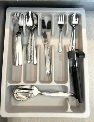a tray with forks and spoons and utensils at Exquisite Japandi 2 & Mediterranean Breeze at Venice w Grand Canal View! in Manila