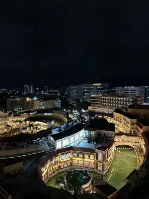a view of a city at night with buildings at Exquisite Japandi 2 & Mediterranean Breeze at Venice w Grand Canal View! in Manila