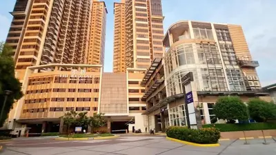 a group of tall buildings in a city at Galini Suites in Manila