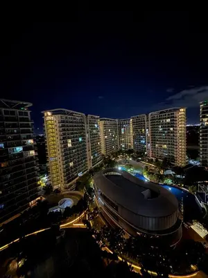a view of a city at night with buildings at Sunset and Breeze by Azure in Manila