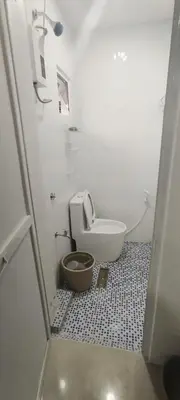 a small bathroom with a toilet in a room at 6 Guest - Unit 4 Studio Type - Container house in Santa Rosa