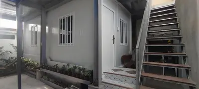 a room with a staircase and a white door at 6 Guest - Unit 4 Studio Type - Container house in Santa Rosa