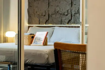 a bedroom with a bed with a mirror at Casa Attila - Azure Urban Resort Residences in Manila