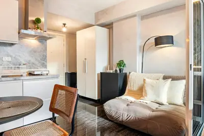 a living room with a couch and a table at Casa Attila - Azure Urban Resort Residences in Manila