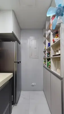 a kitchen with white walls and a refrigerator and shelves at 1 Master BR with full bathroom and JET TUB plus 2nd BR with full bathroom Elegant fully furnished with hotel feels in Manila