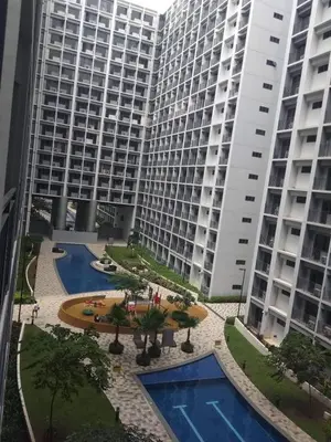 a view of two tall buildings and a courtyard at Smdc shore 2 tower 2 in Manila