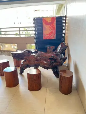 a statue of a bear sitting next to some stools at R&R Entire Rental Unit in Manila