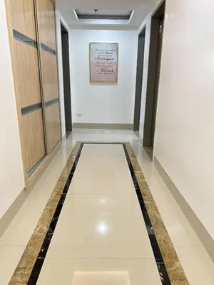 a corridor in a building with a tile floor at R&R Entire Rental Unit in Manila