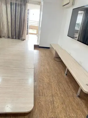 a room with two wooden benches on the wall at R&R Entire Rental Unit in Manila
