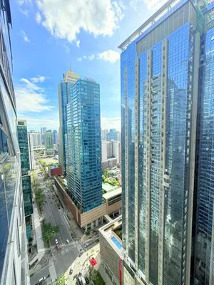 an aerial view of a city with tall buildings at Relaxing and Comfy in Manila