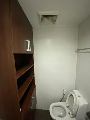 a small bathroom with a toilet and a sink at Prime Location and Affordable Studio Condo in Legaspi Village, Makati with City view in Manila
