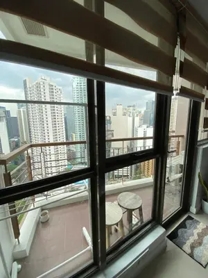 a window with a view of a city skyline at Prime Location and Affordable Studio Condo in Legaspi Village, Makati with City view in Manila