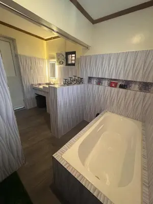 a bathroom with a large bath tub in it at CasaCavite - Your Chill Hideaway and Mini-Resort Just Minutes from all the Tagaytay-Silang-Nuvali Action! in Silang