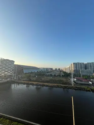 a view of a river with buildings in the background at Monarch Park-suites Condominium in Manila