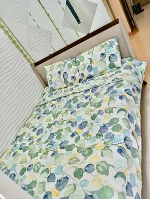 a bed with a comforter and pillows on it at la Chicka - 295 T3 in Manila