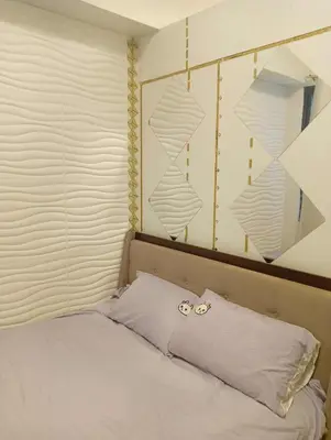 a bedroom with a bed with two rings on the pillow at la Chicka - 295 T3 in Manila