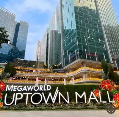 a sign in front of a downtown mall at 42nd Floor 2BR with Stunning Views & 7 Pools in Manila