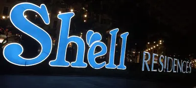 a sign that says sitzilli on the side of a building at Shell Residence in Manila