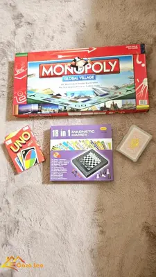 a monopoly board game and other items on the floor at Cozy Staycation in Mandaluyong in Manila