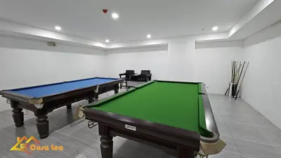 a room with two pool tables in it at Cozy Staycation in Mandaluyong in Manila