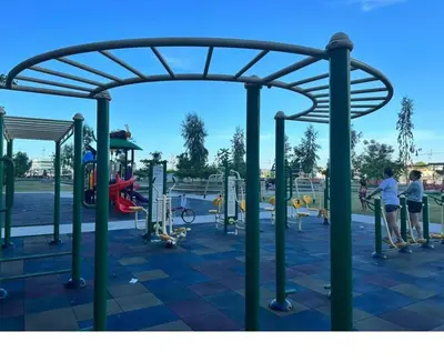 a group of people standing in a playground at E&L Family Suite in Manila