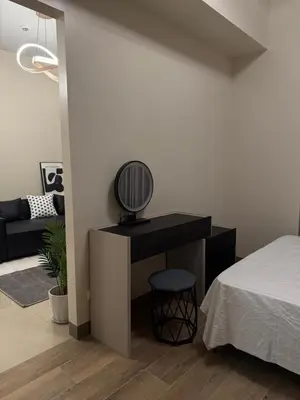 a bedroom with a bed and a desk with a mirror at Luxurious Modern Cozy Manila Bayview Pool View 1 2 3 Bedrooms Near Manila Airports Okada Solaire MOA in Manila