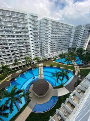 an overhead view of a large pool in front of buildings at Moa shell residence pasay city in Manila