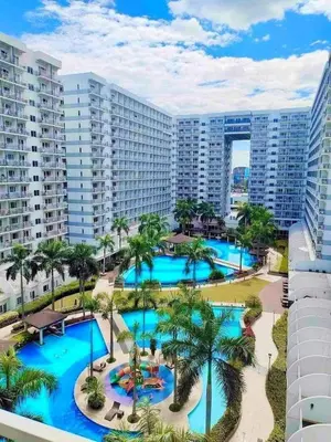 an aerial view of the pool at the resort at Moa shell residence pasay city in Manila