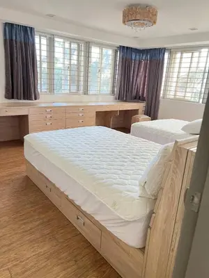 a bedroom with two large beds and windows at R&R Entire Rental Unit in Manila