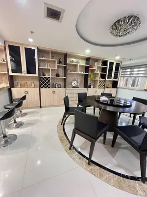 a dining room with a table and chairs at R&R Entire Rental Unit in Manila