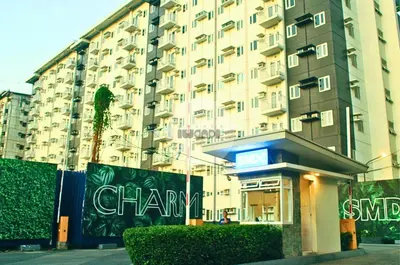 a large building with a chantry sign in front of it at iWandr Suites at SMDC Charm Residences in Manila
