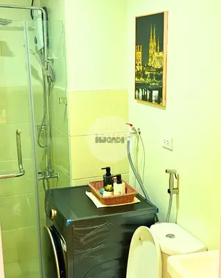 a bathroom with a sink and a toilet at iWandr Suites at SMDC Charm Residences in Manila