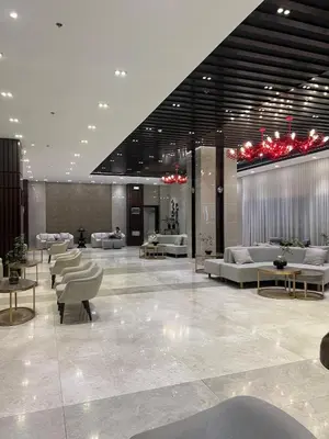 a lobby with couches and tables in a building at The Makati Suites at Red Residences, Premium Studio, City View, Makati CBD, Wi-fi in Manila