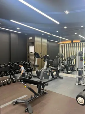 a gym with several treadmills and exercise bikes at The Makati Suites at Red Residences, Premium Studio, City View, Makati CBD, Wi-fi in Manila