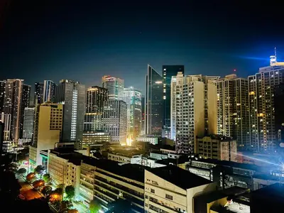 a view of a city at night with buildings at The Makati Suites at Red Residences, Premium Studio, City View, Makati CBD, Wi-fi in Manila