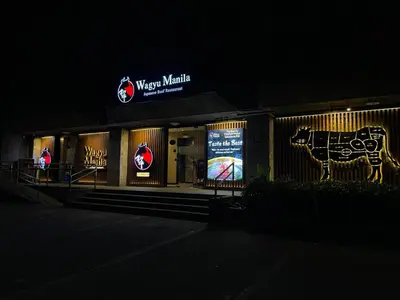 a building with a cow painted on the side of it at The Makati Suites at Red Residences, Premium Studio, City View, Makati CBD, Wi-fi in Manila