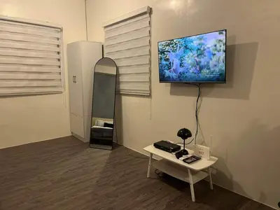 a room with a flat screen tv on a wall at Amaia step parkway nuvali studio in Calamba
