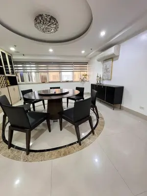 a dining room with a table and chairs at R&R Empire Rental Unit in Manila