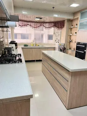 a large kitchen with a stove and a sink at R&R Empire Rental Unit in Manila