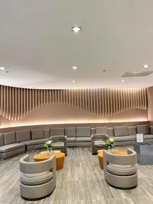 a waiting area with couches and tables in a lobby at Shore 1 Tower D in Manila