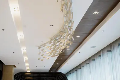 a chandelier hanging from the ceiling of a building at Blue Horizon - Newly renovated condo near MOA in Manila